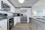 Kitchen is equipped with stainless steel appliances, plenty of kitchenware to cook up a feast or snack for the beach. 